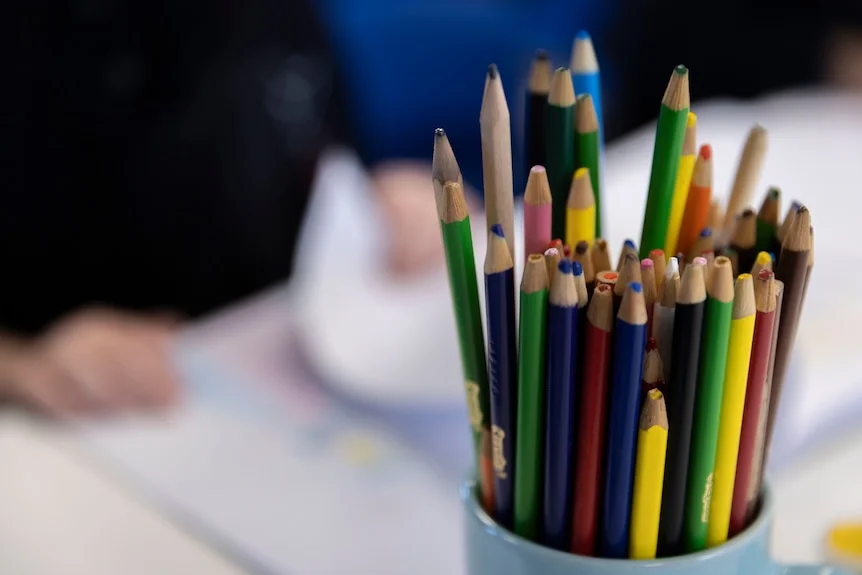 Colorful pencils on a desk.