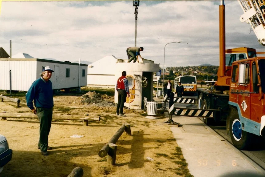 Erecting a bus shelter.