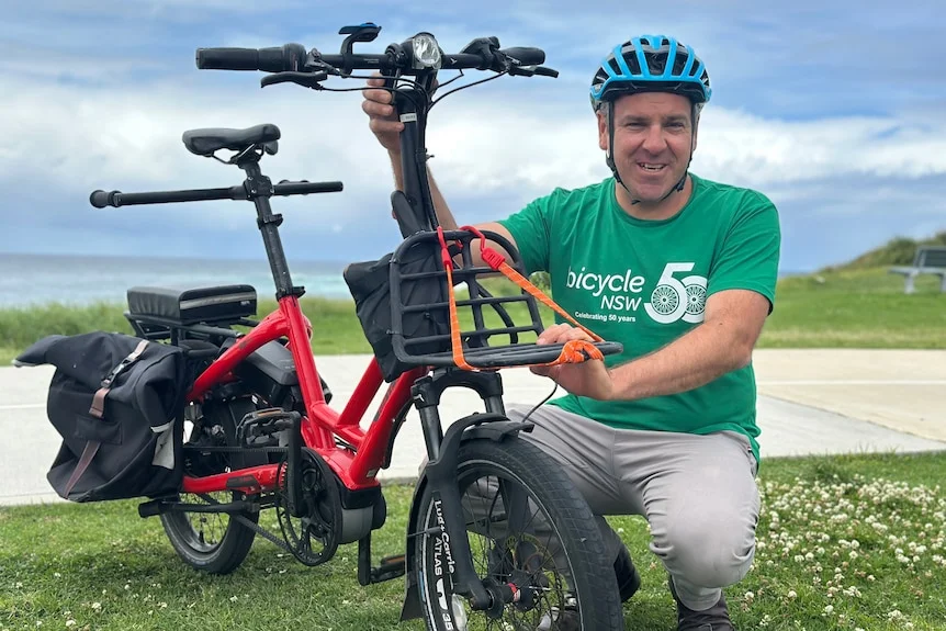 image of man with bike