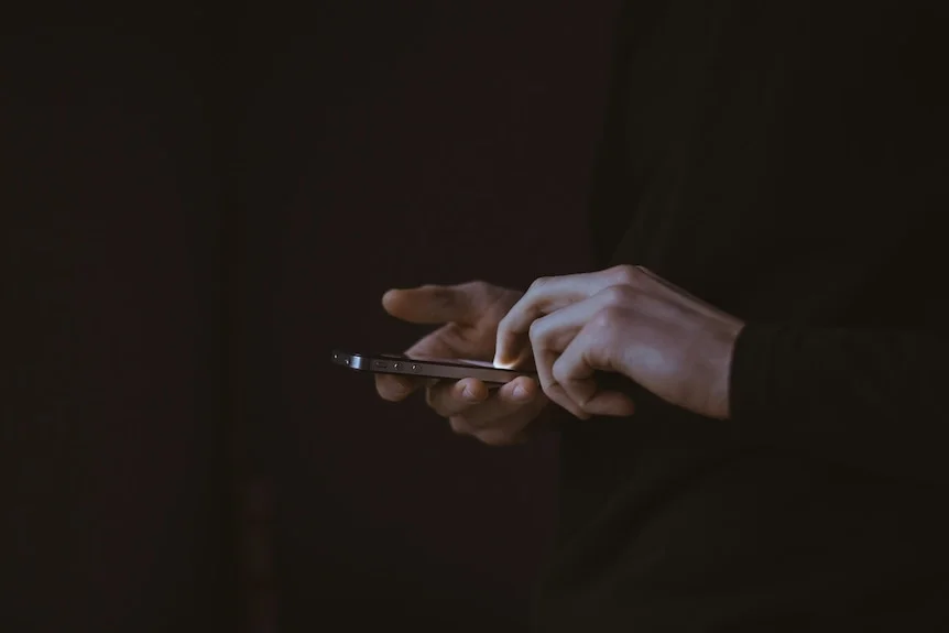 A person scrolling on their smart phone
