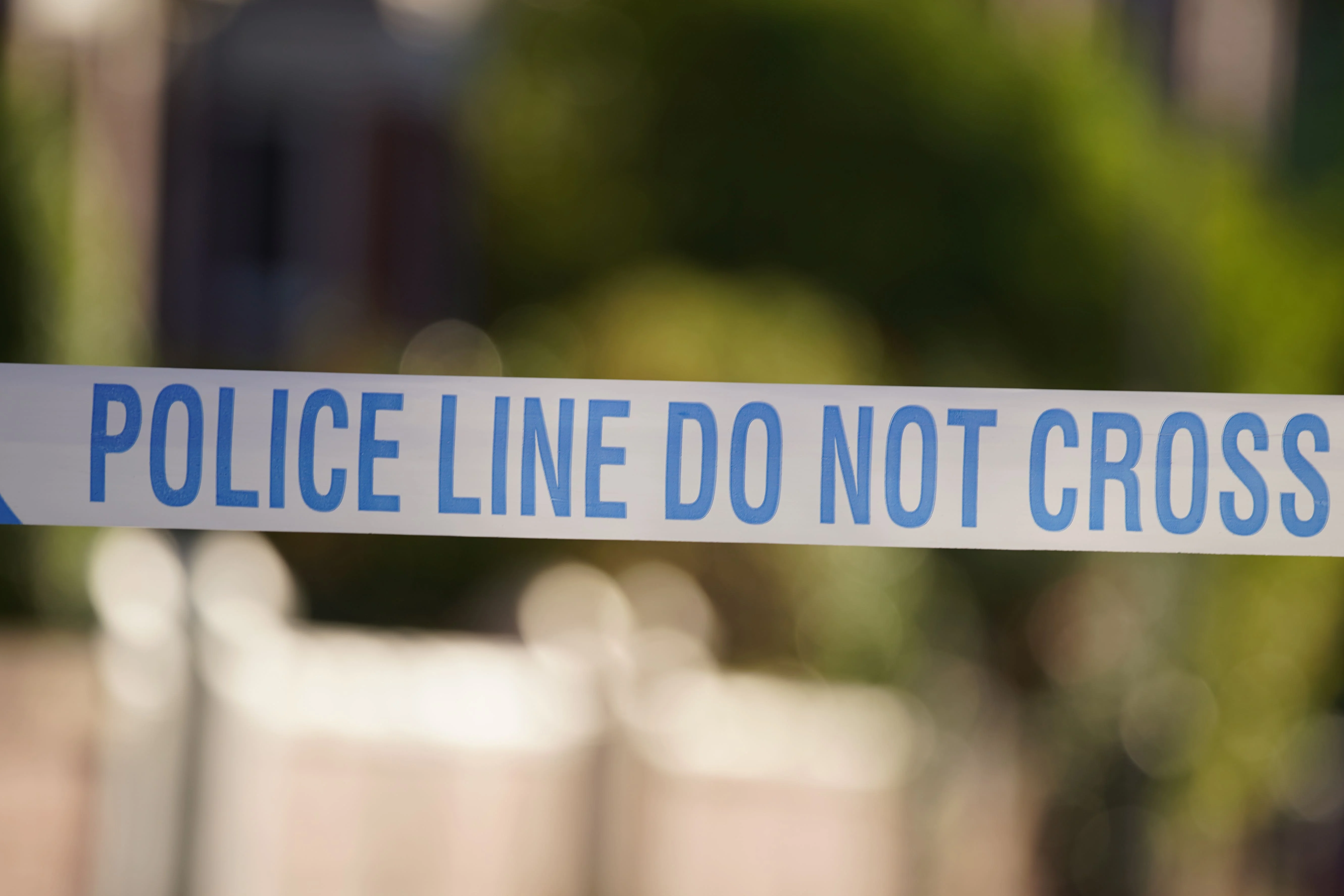 Police tape at a scene (Peter Byrne/PA)
