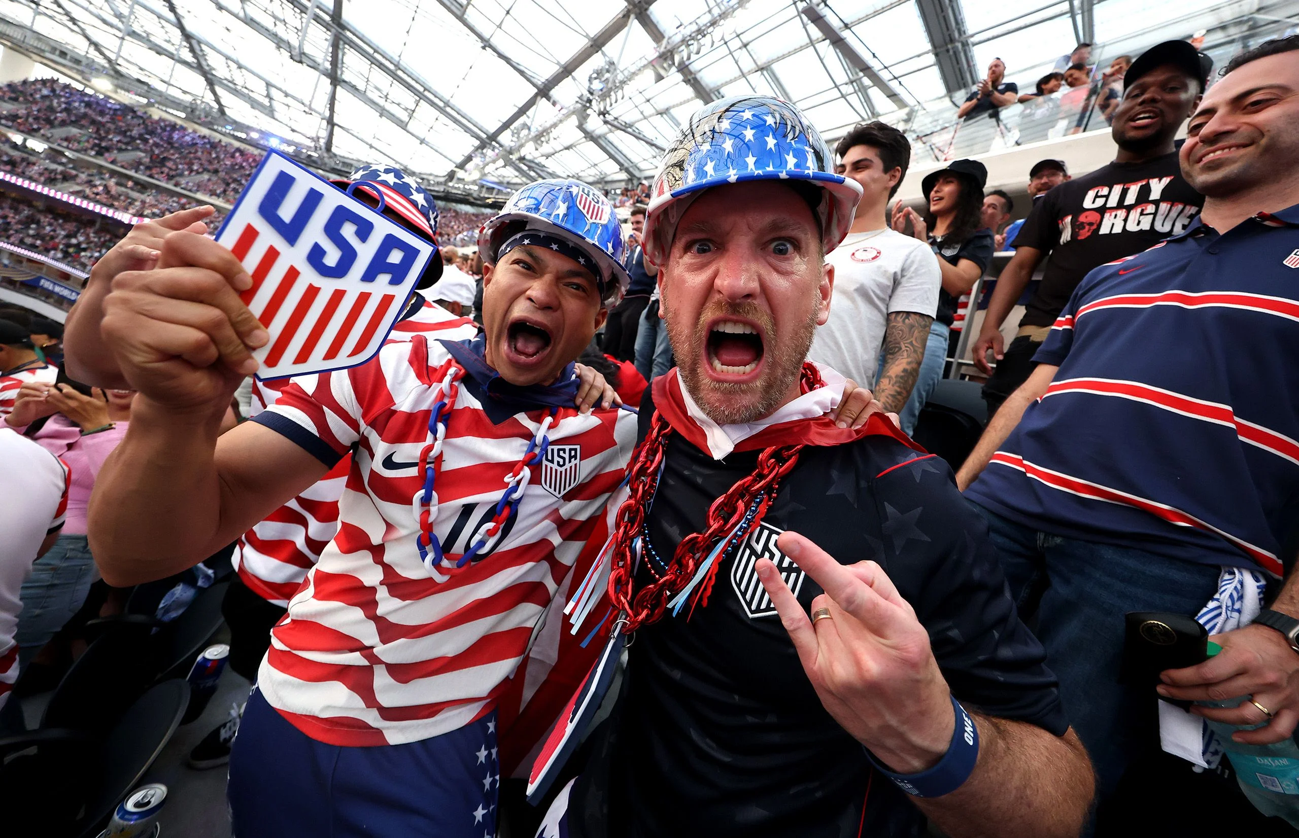 Fans cheering.