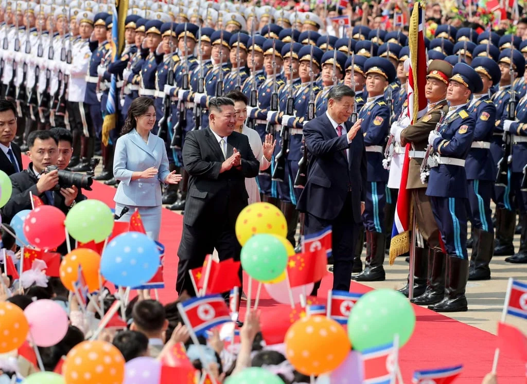 North Korean leader Kim Jong-un (centre left) and his wife Ri Sol-ju (left) see off China’s President Xi Jinping (centre right) and his wife Peng Liyuan at Pyongyang International Airport on Tuesday. Photo: KCNA/AFP North Korean leader Kim Jong-un (centre left) and his wife Ri Sol-ju (left) see off China’s President Xi Jinping (centre right) and his wife Peng Liyuan at Pyongyang International Airport on Tuesday. Photo: KCNA/AFP
