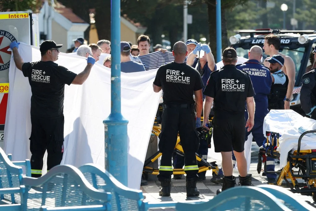 Emergency personnel attend the scene of a shark attack at Coogee Beach in Sydneyon Saturday. Photo: Reuters