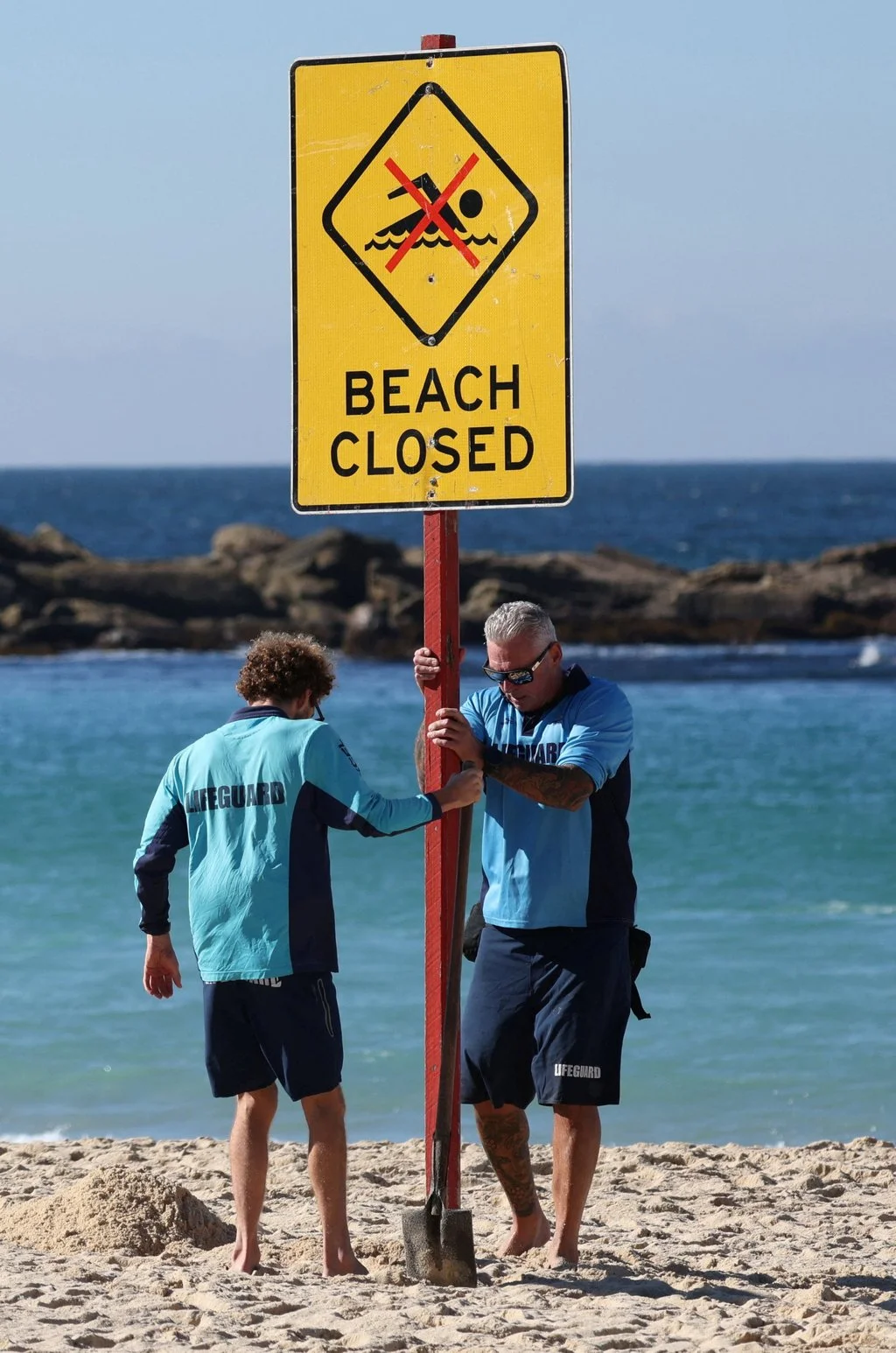 Lifeguards close Sydney’s Coogee Beach following a shark attack on Saturday. Photo: Reuters Lifeguards close Sydney’s Coogee Beach following a shark attack on Saturday. Photo: Reuters