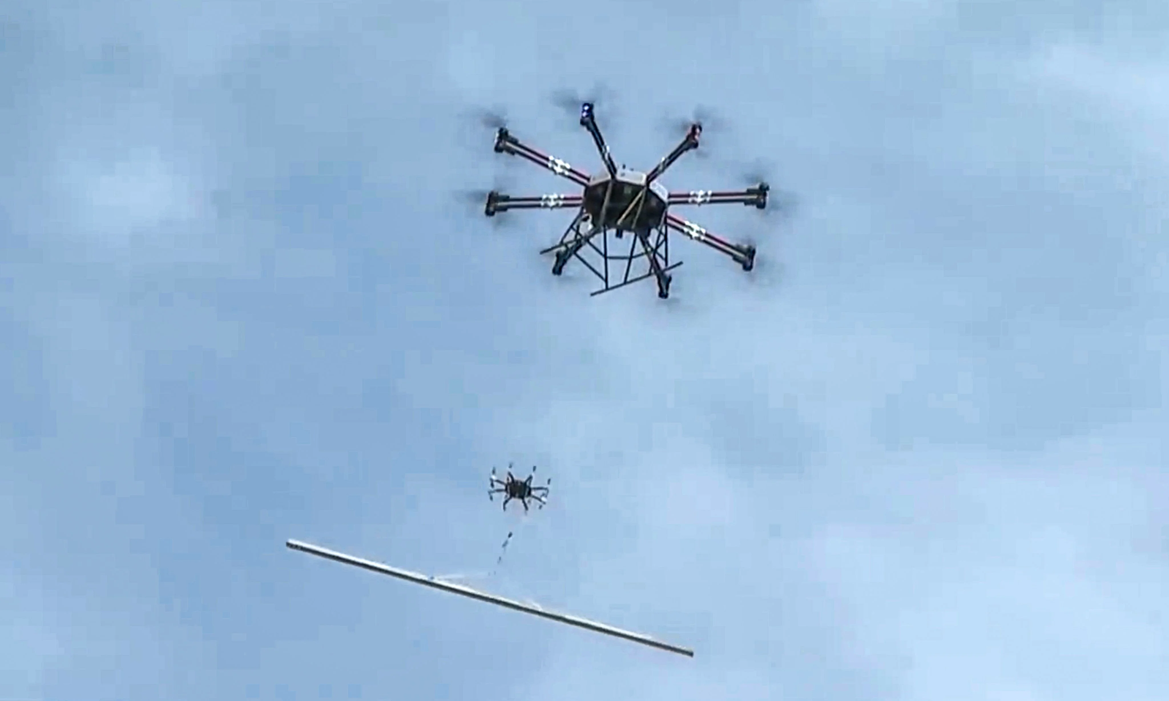 Heavy-lift drones transport construction materials up a remote mountain in southwest mainland China. Photo: CCTV