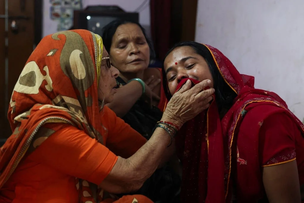 Sushila Devi, wife of Shivanand Chaurasia, mourns her husband in Deoria, Uttar Pradesh, on Friday. Photo: Reuters