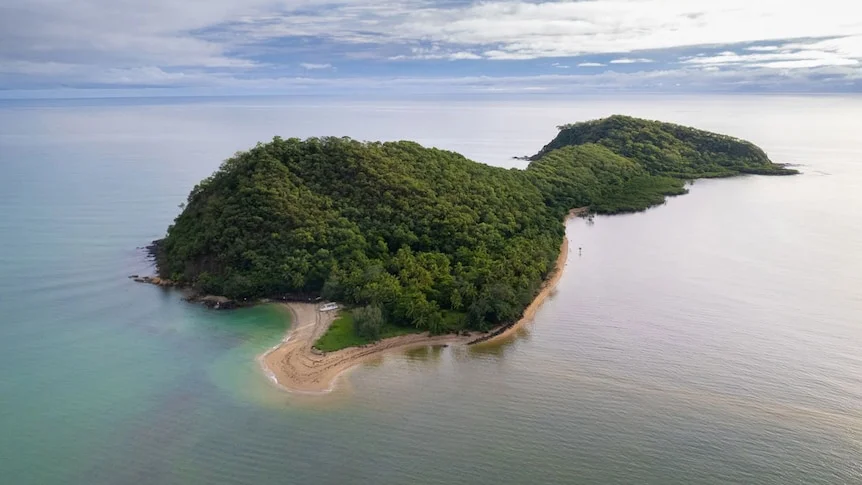 An aerial shot of a small island in the middle of the ocean