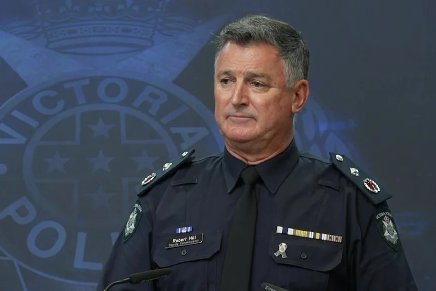 Deputy Commissioner Bob Hill in police uniform looking serious.