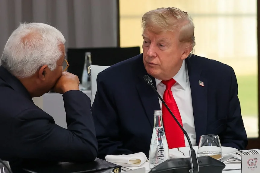 Donald Trump listens to European Council President Antonio Costa