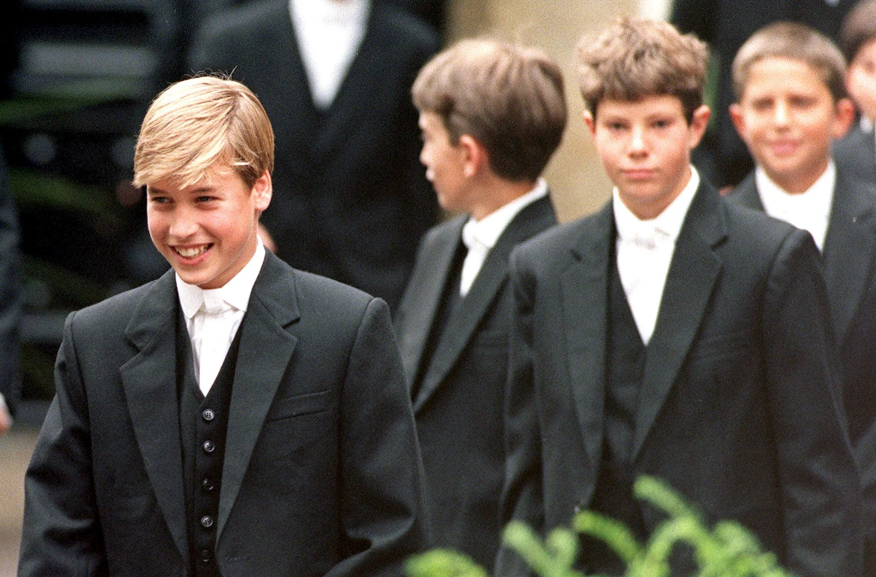 Prince William (now the Prince of Wales) leads his classmates to lessons on his first day at Eton School