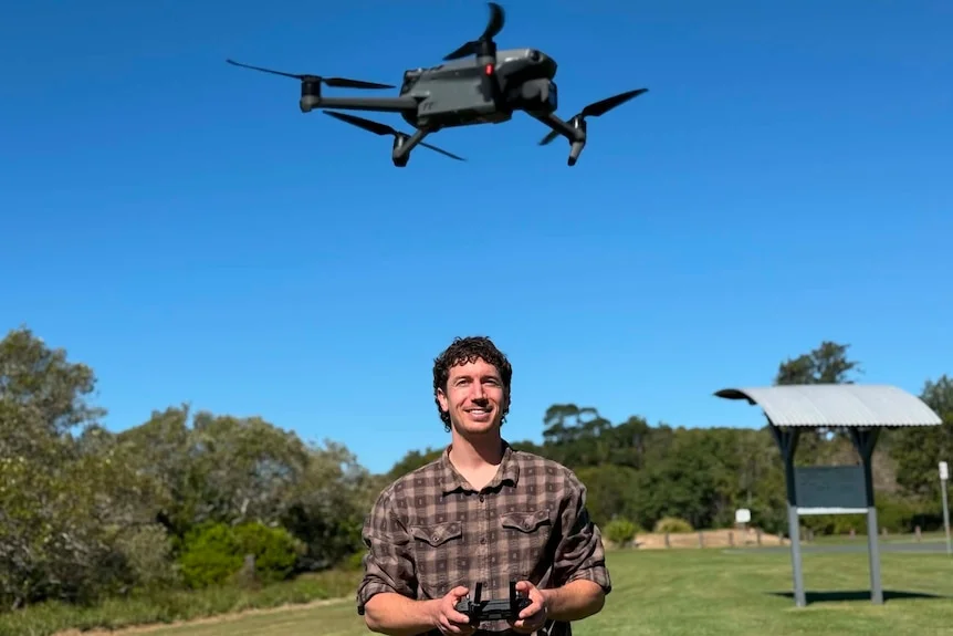 Man operating a drone