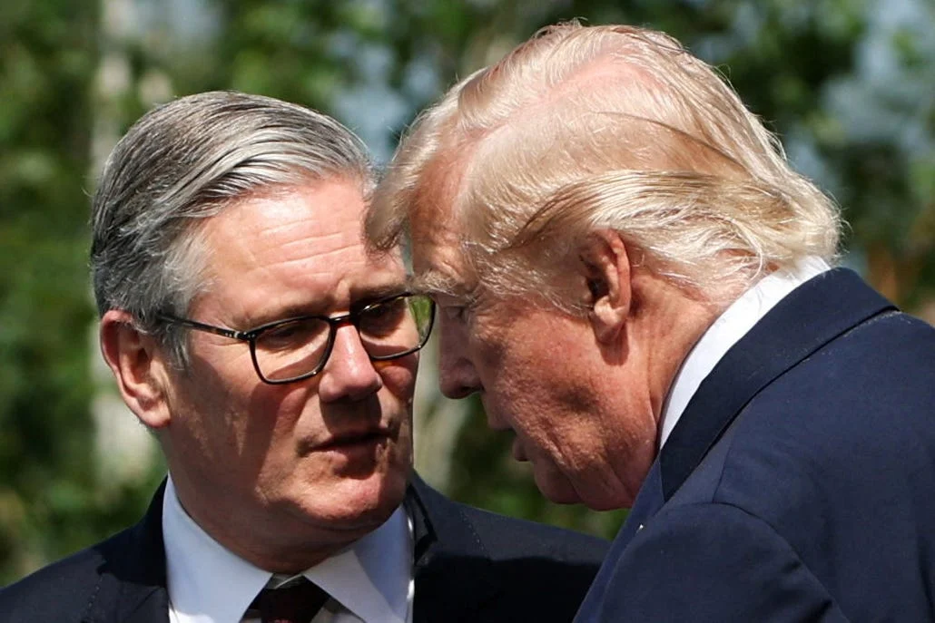 Prime Minister Sir Keir Starmer (left) and US President Donald Trump talk ahead of a family photo during the G7 summit in Evian, France. Picture date: Tuesday June 16, 2026.