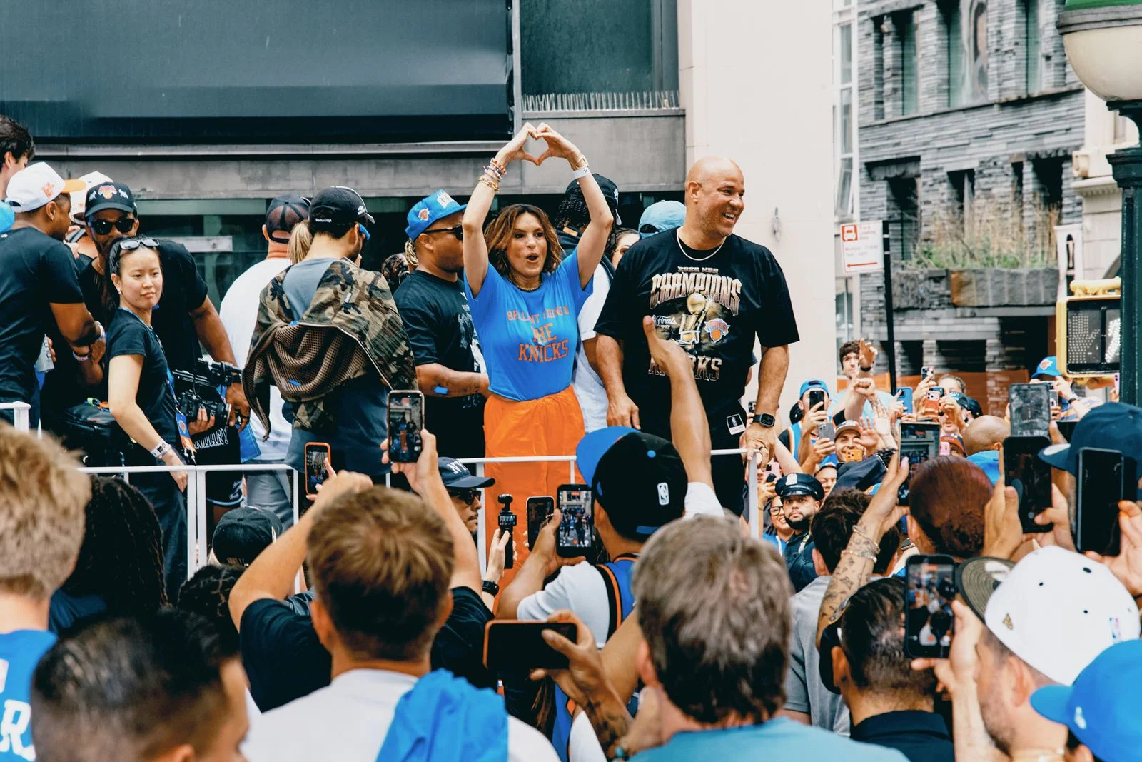 Figures cheer in crowd