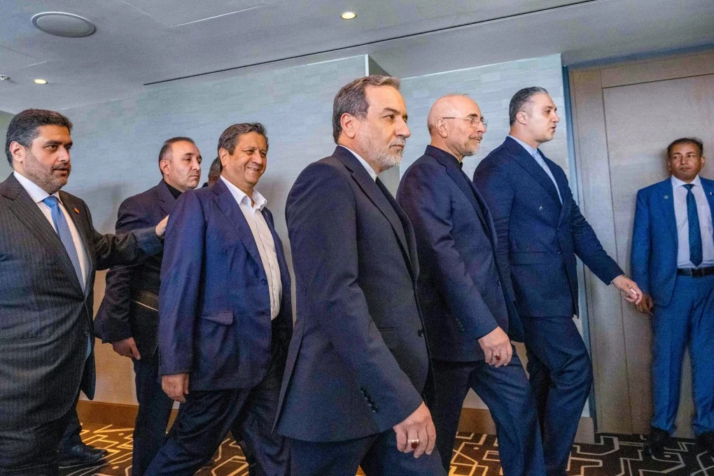 Iran’s delegation, including Foreign Minister Abbas Araghchi (centre), arrive for a quadrilateral meeting on Sunday in Switzerland. Photo: AFP