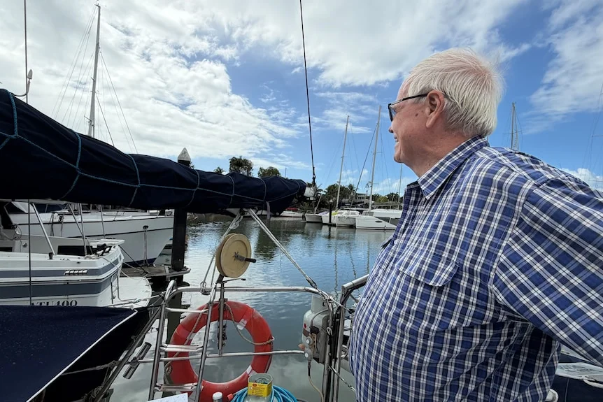 Man looking out over marina