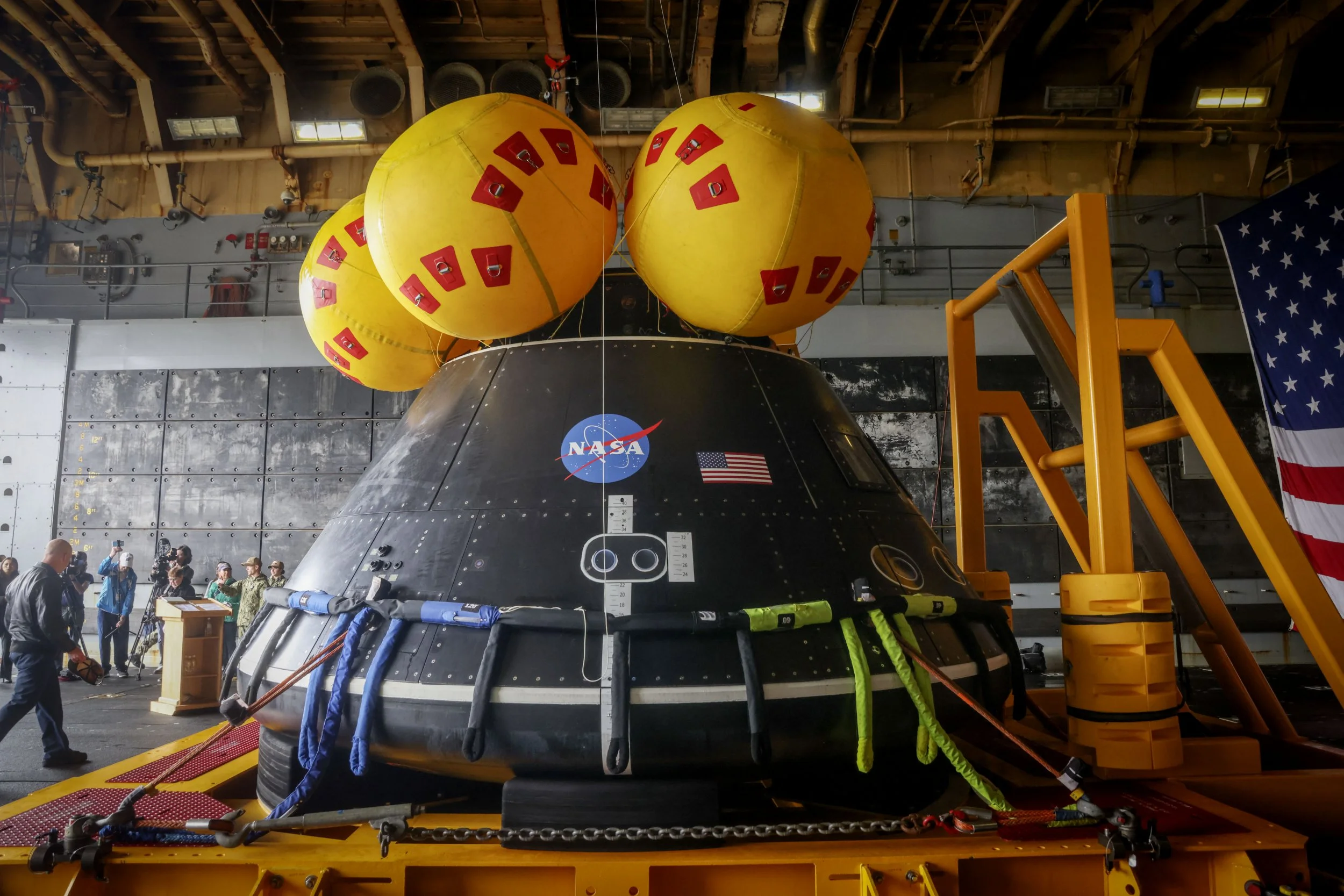The Artemis II Spacecraft is seen aboard the USS Somerset (LPD 25) during the Artemis Moon mission recovery demonstration at Naval Base San Diego, California, on March 31, 2025. NASA and the Department of Defense host a media event on the recovery operations that will bring the Artemis II astronauts and the agency's Orion spacecraft home at the conclusion of next year's mission around the Moon. (Photo by SANDY HUFFAKER / AFP) (Photo by SANDY HUFFAKER/AFP via Getty Images)