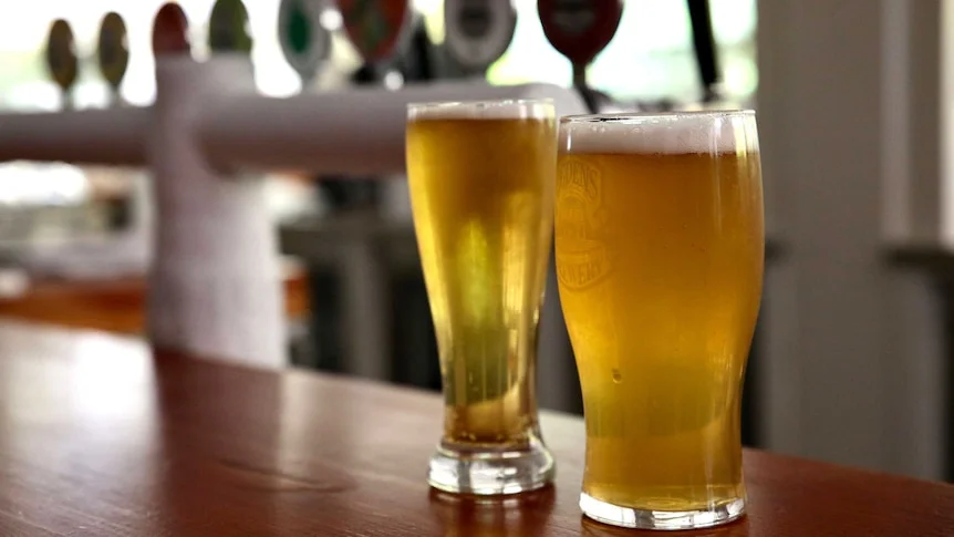 Beers sitting on a pub counter