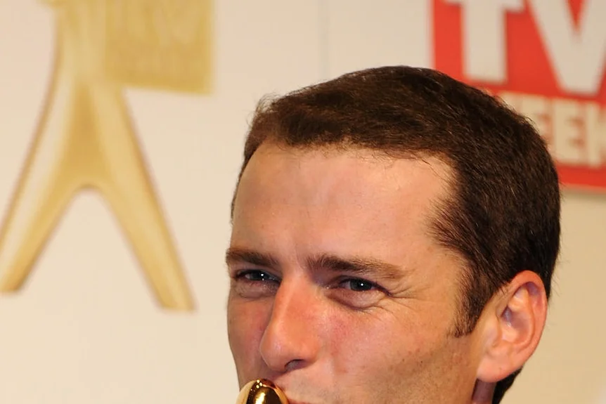 Karl Stefanovic from the Channel 9's Today Show kisses his Gold Logie