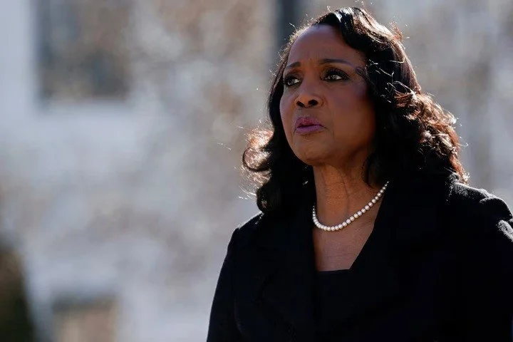 An African-American woman walks outside the US Supreme Court.