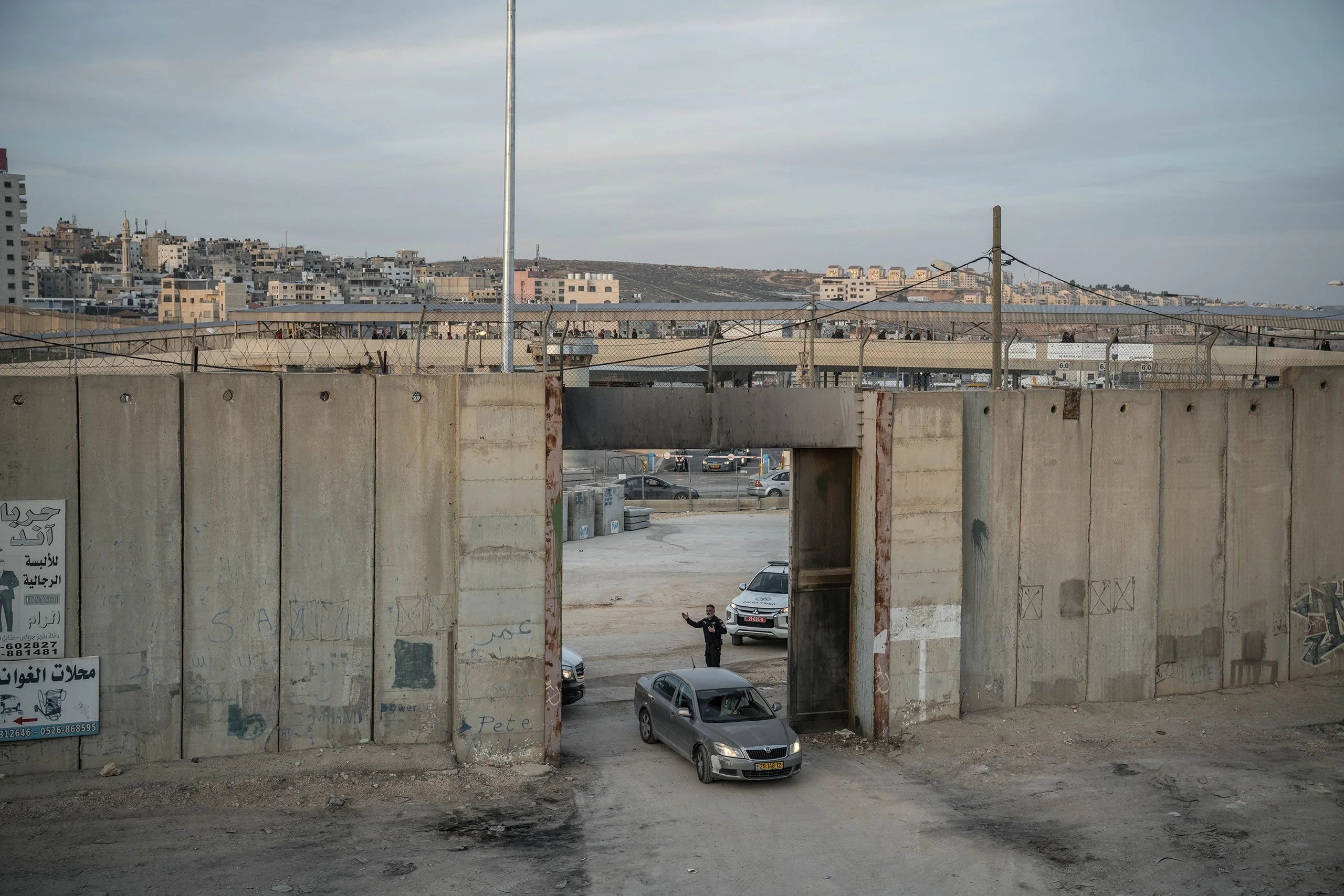 Cars drive through a wall