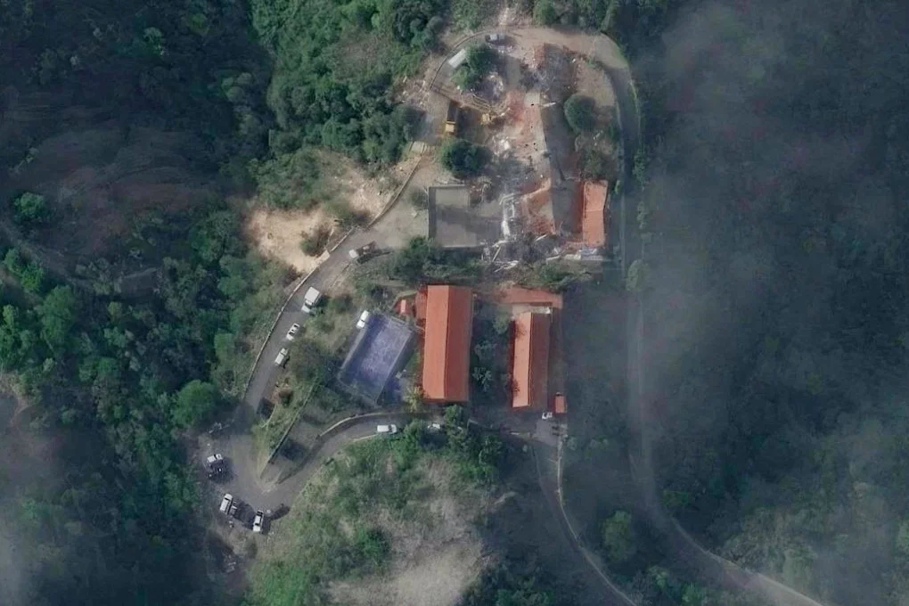 A satellite view captures the extensive structural damage at the Hotel Santuario La Llanada in La Guaira, where more than 100 US deportees had arrived hours earlier. Photo: Vantor via Reuters